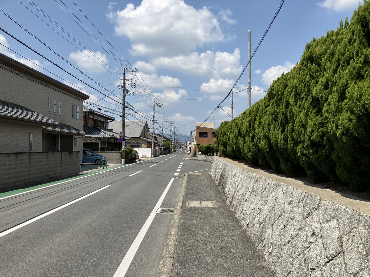 Continuing straight with the Ichijo High School grounds on the right
