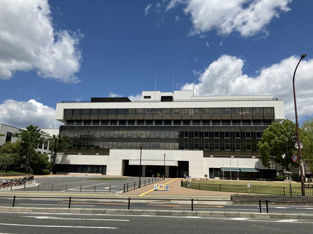 Nara City Hall building exterior under a blue sky with white clouds